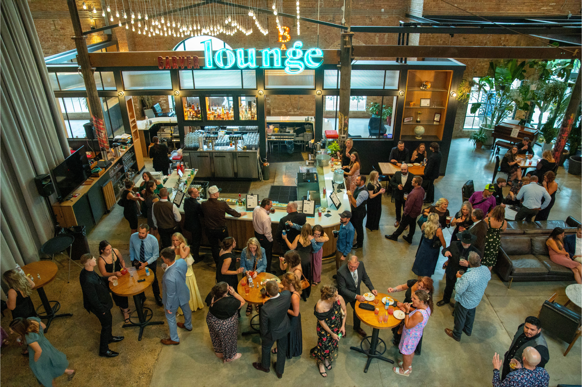 Interior of the Garver Lounge with warm lighting, craft cocktail bar, and comfortable seating